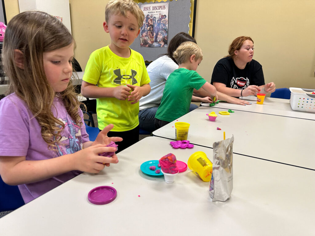 kids playing with play doh