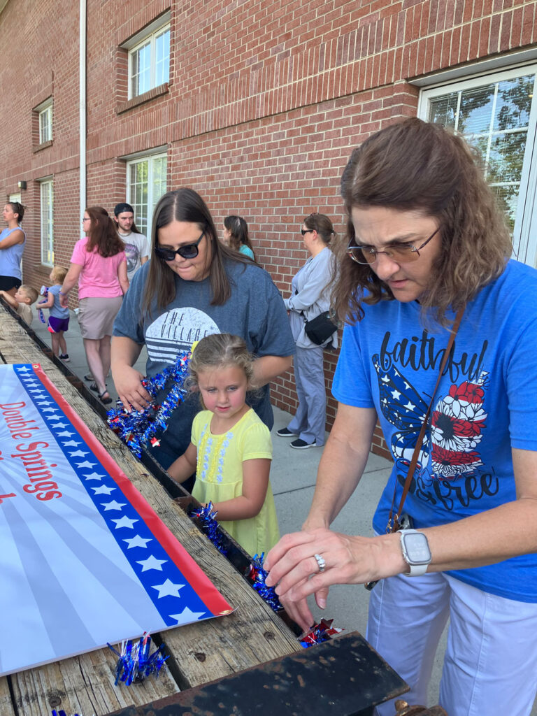 ladies decorating the church's July 4th float for the Lattimore parade